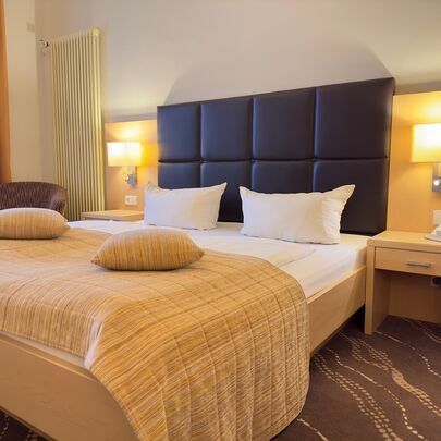 Bett im Komfort-Zimmer Parkhotel Bad Schandau